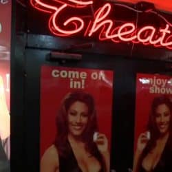 Busty babe gangbang in adult theater